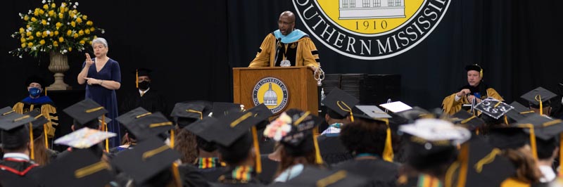 President Bennett addressing graduates