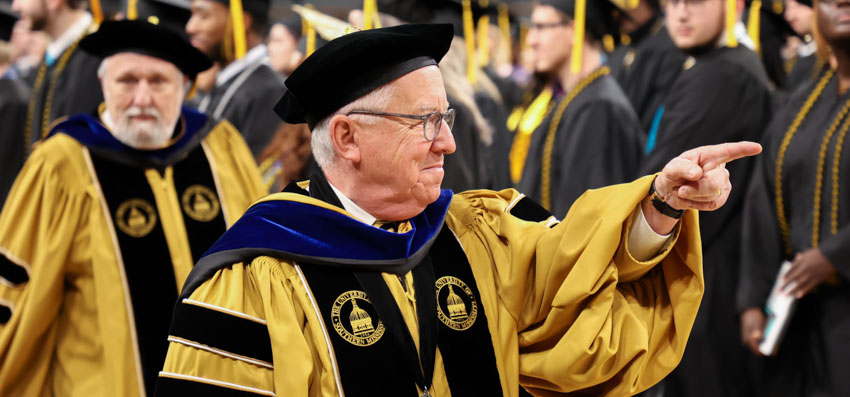 Joe Paul points at graduation