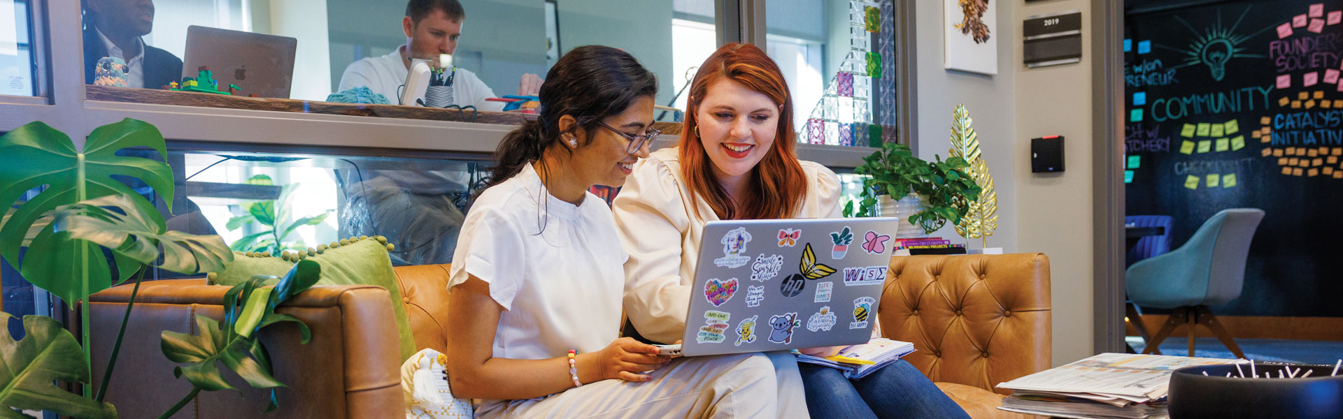 two people on a computer