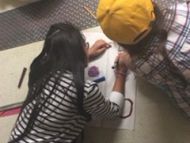 Two students in tyhe Science of Drones Class work on a new design.