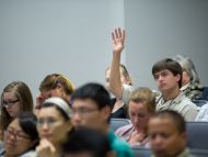 Participant asks question during Q&A session