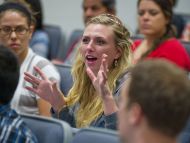 Participant asks question during Q&A session