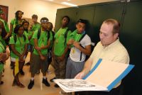 Dr. Mac Alford showing plant specimens