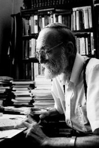 Art Kaul sitting at his desk reading