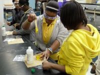 Students from Hattiesburg Middle School participate in hand-on demos. 