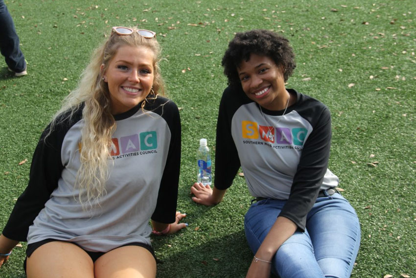 Two students smiling