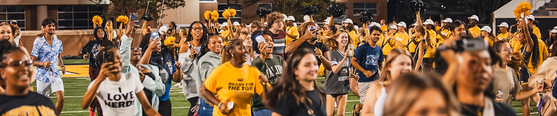 students running onto the field