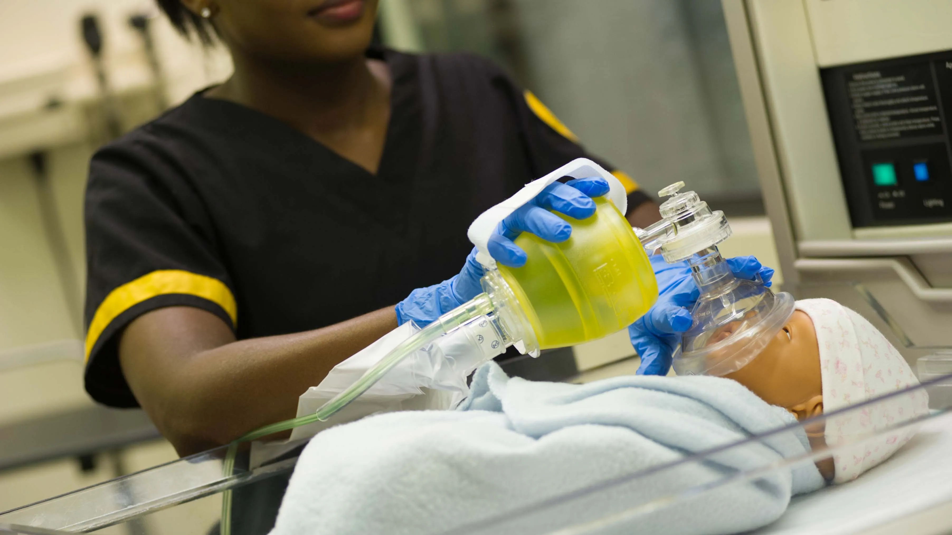 a student nurse performs a task in a lab setting