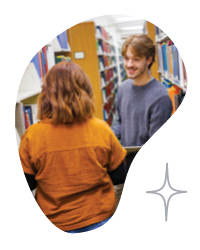 two people talking in a library